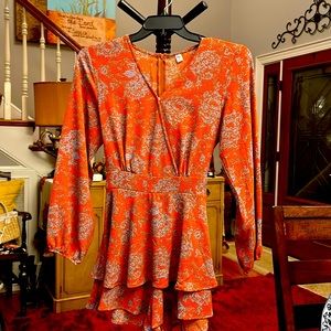 Orange and blue, jumpsuit shorts.